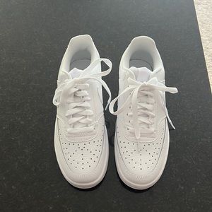 All white Nike low top, size 8.